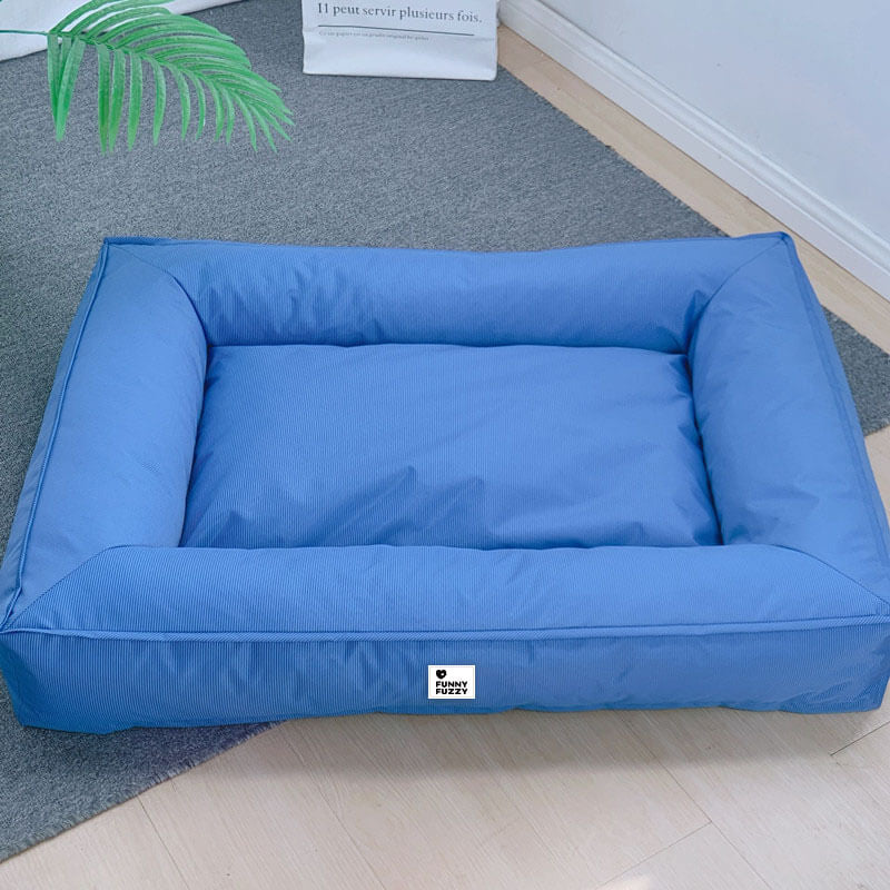 Waterproof fully enclosed dog bed with raised bolstered edges