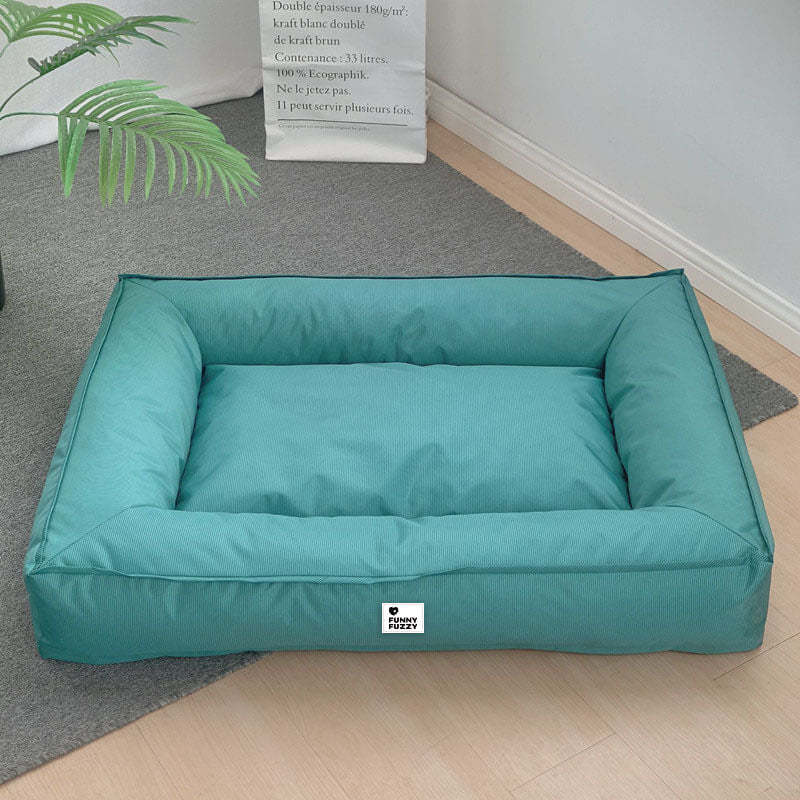 Waterproof fully enclosed dog bed with raised bolstered edges