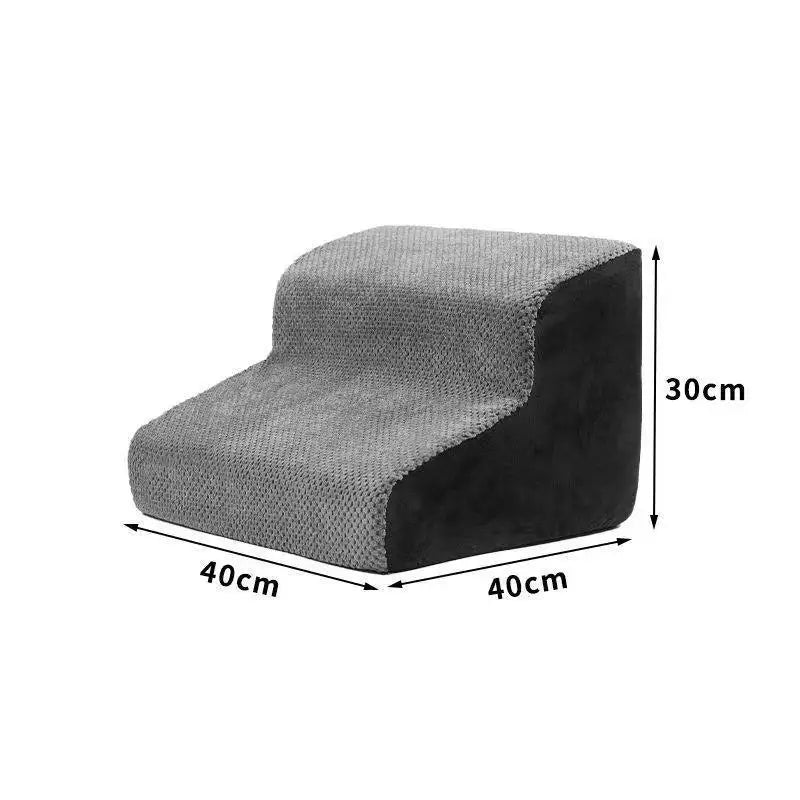 Foam pet stairs with a removable fleece cover beside a bed