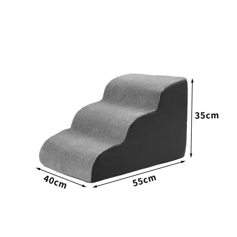 Foam pet stairs with a removable fleece cover beside a bed